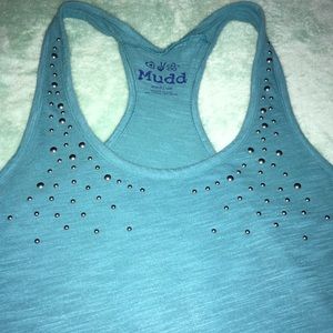 Green tank top with dark silver studs.